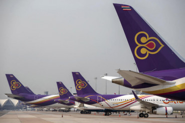 Thai Airways says will cut workforce by half