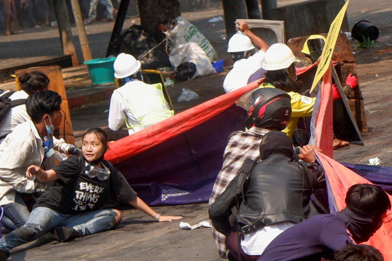 Protesters lie on the ground after police opened fire to disperse an anti-coup protest in Mandalay, Myanmar, on Thursday. Among them is Angel, 19, bottom-left, also known as Kyal Sin, who took cover and was later shot in the head. (Photo: stringer/Reuters) Protesters lie on the ground after police opened fire to disperse an anti-coup protest in Mandalay, Myanmar, on Thursday. Among them is Angel, 19, bottom-left, also known as Kyal Sin, who took cover and was later shot in the head. (Photo: stringer/Reuters)