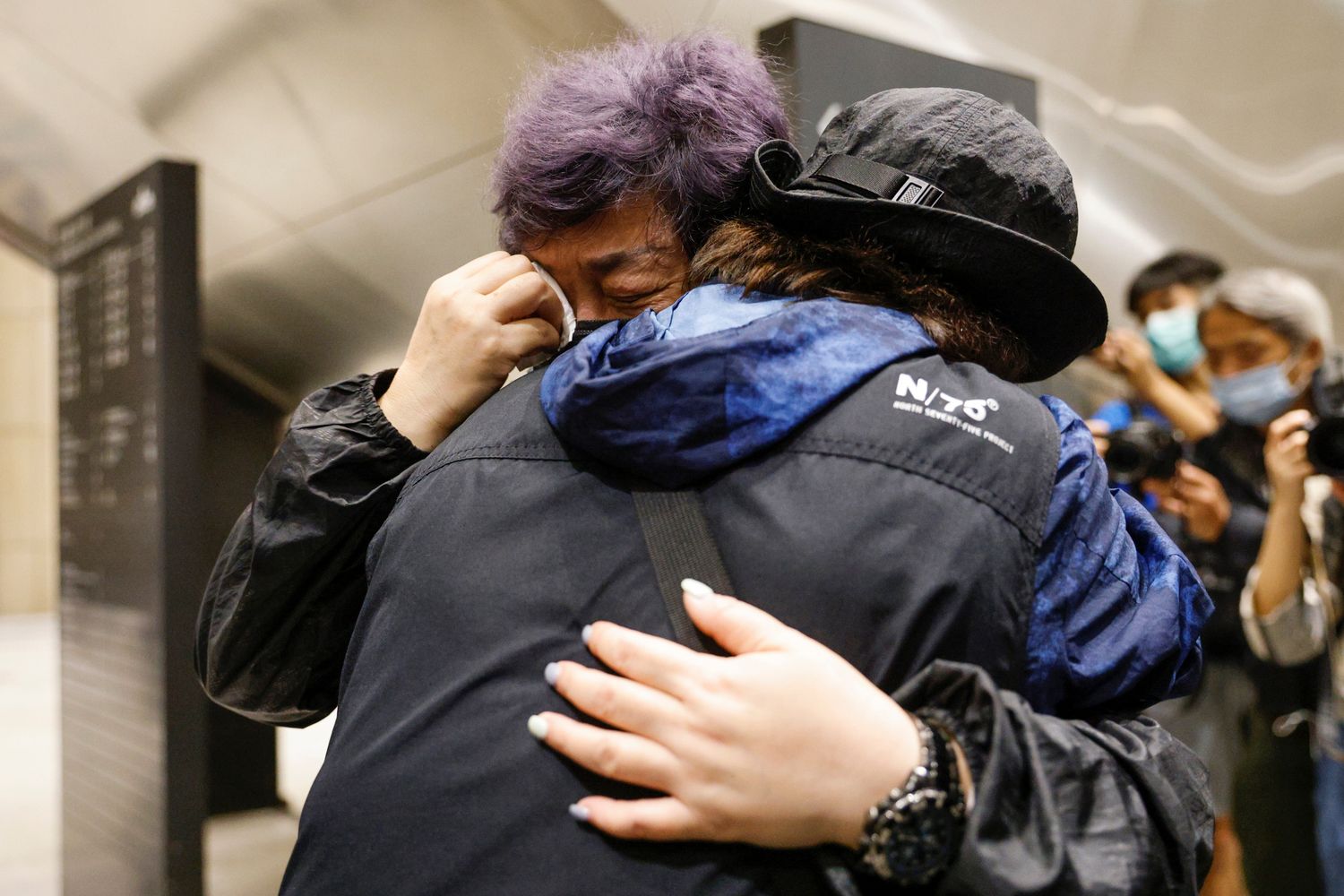 Supporter of pro-democracy activists cries after court grants bail to 15 of 47 democracy activists charged with subversion over national security law at West Kowloon Magistrates' Courts, in Hong Kong, on Thursday. (Reuters photo) Supporter of pro-democracy activists cries after court grants bail to 15 of 47 democracy activists charged with subversion over national security law at West Kowloon Magistrates' Courts, in Hong Kong, on Thursday. (Reuters photo)