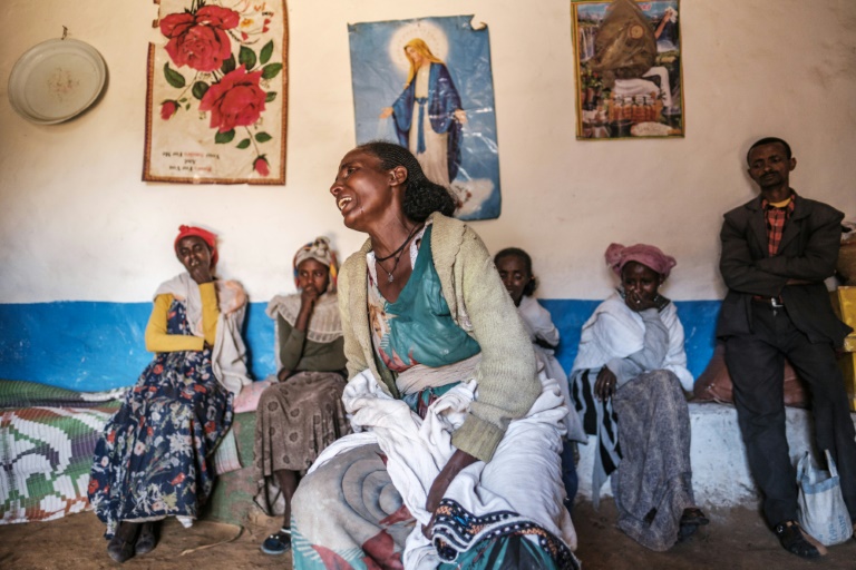 Beyenesh Tekleyohannes cries in her home as a group of relatives look on in the village of Dengolat, north of Mekele, the capital of Tigray, in February 2021. Beyenesh Tekleyohannes cries in her home as a group of relatives look on in the village of Dengolat, north of Mekele, the capital of Tigray, in February 2021.