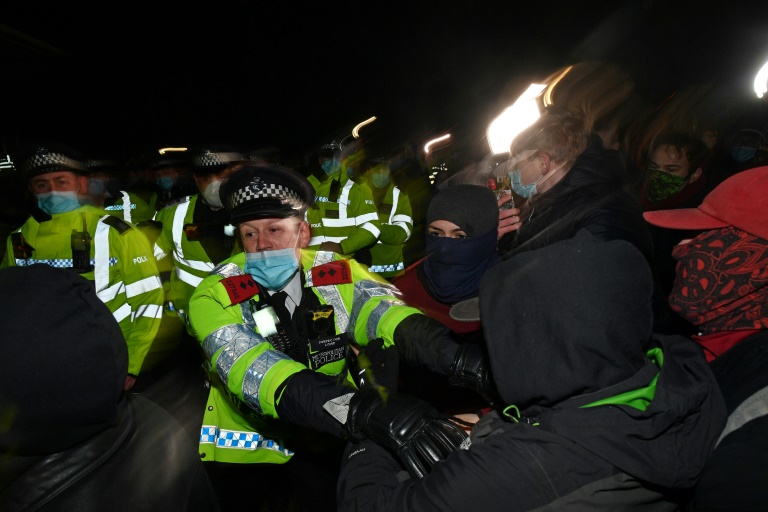 Police officers scuffled with some members of the hundreds-strong crowd that gathered in the evening despite coronavirus restrictions for a candlelit tribute.