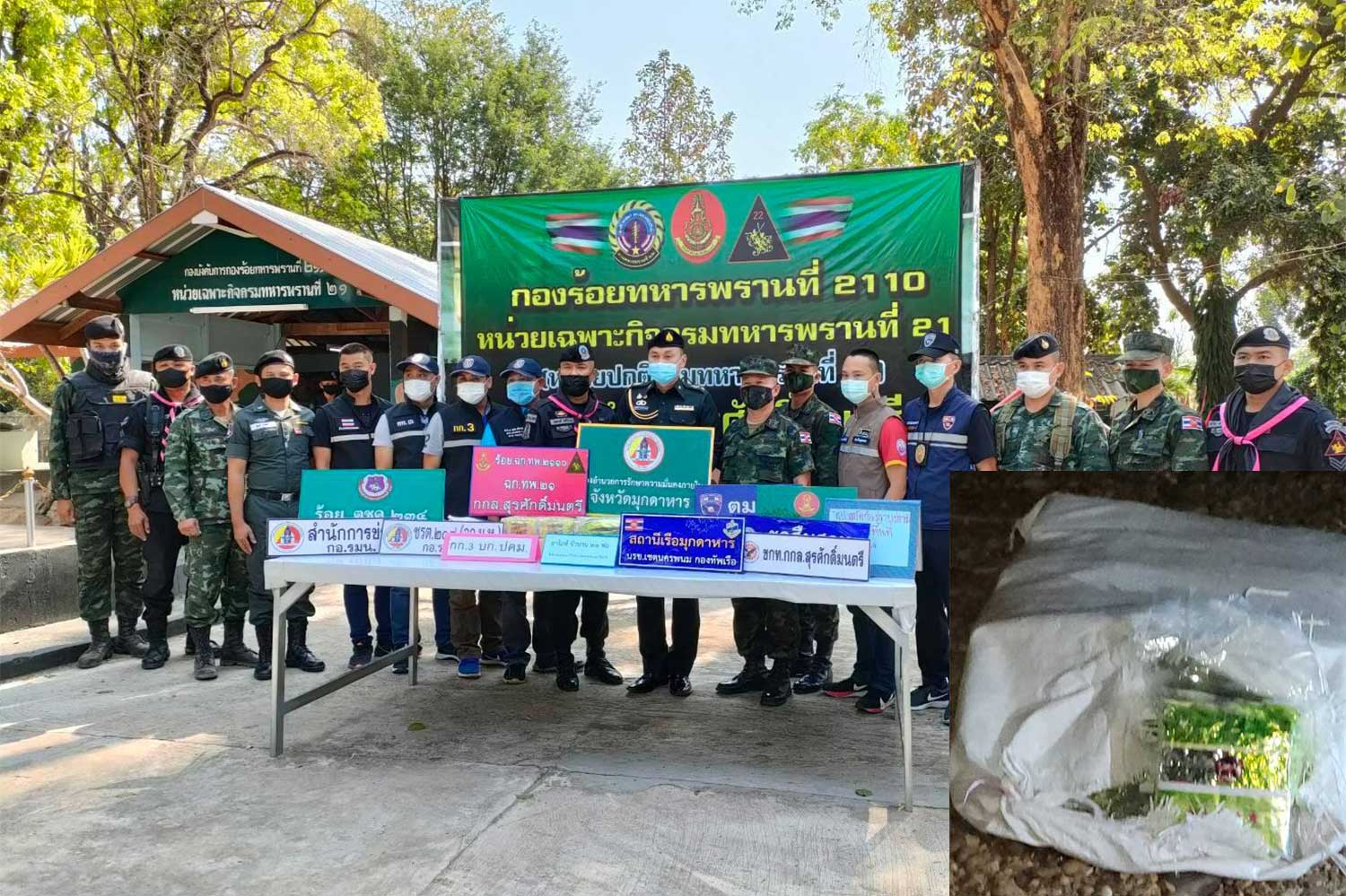 The 21kg of seized crystal methamphetamine is displayed during a media briefing in Mukdahan on Wednesday. It was left on the bank of the Mekong River by a fleeing  smuggler in a boat. (Photo: @surasakmontri military task force Facebook page)