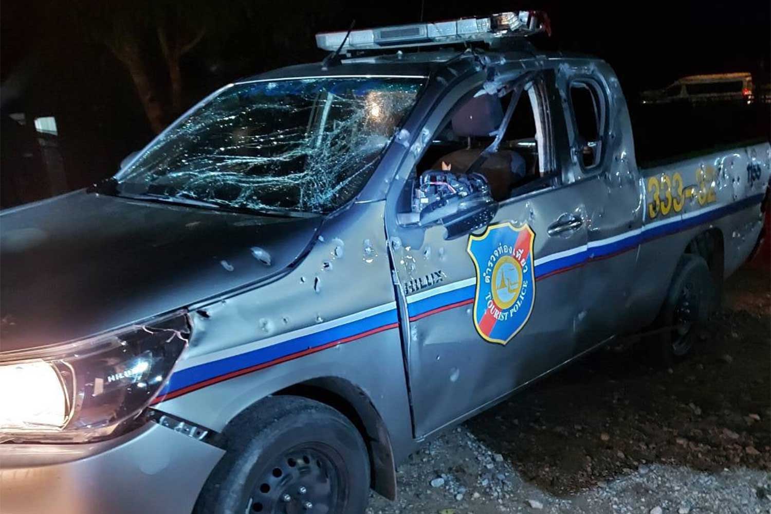 The tourist police vehicle damaged by a roadside bomb in Bannang Sata district, Yala, on Thursday night. A tourist policeman and a police volunteer were wounded.(Photo: @maeluang318133, Maeluang Pattani Centre Facebook page)