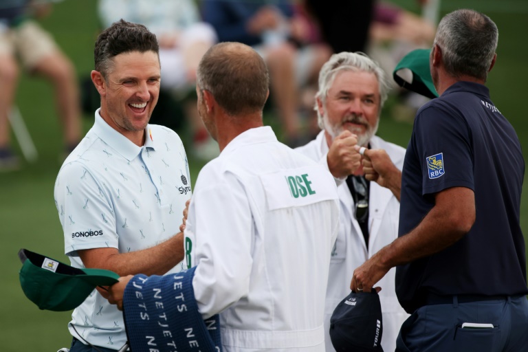 England's Justin Rose, left, bumps fists with caddie David Clark after firing a seven-under par 65 in Thursday's opening round of the Masters. England's Justin Rose, left, bumps fists with caddie David Clark after firing a seven-under par 65 in Thursday's opening round of the Masters.