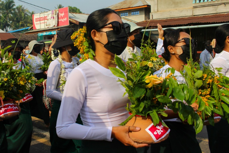 Protestors have been painting pro-democracy messages on flower pots traditionally displayed to welcome the Myanmar new year. Protestors have been painting pro-democracy messages on flower pots traditionally displayed to welcome the Myanmar new year.