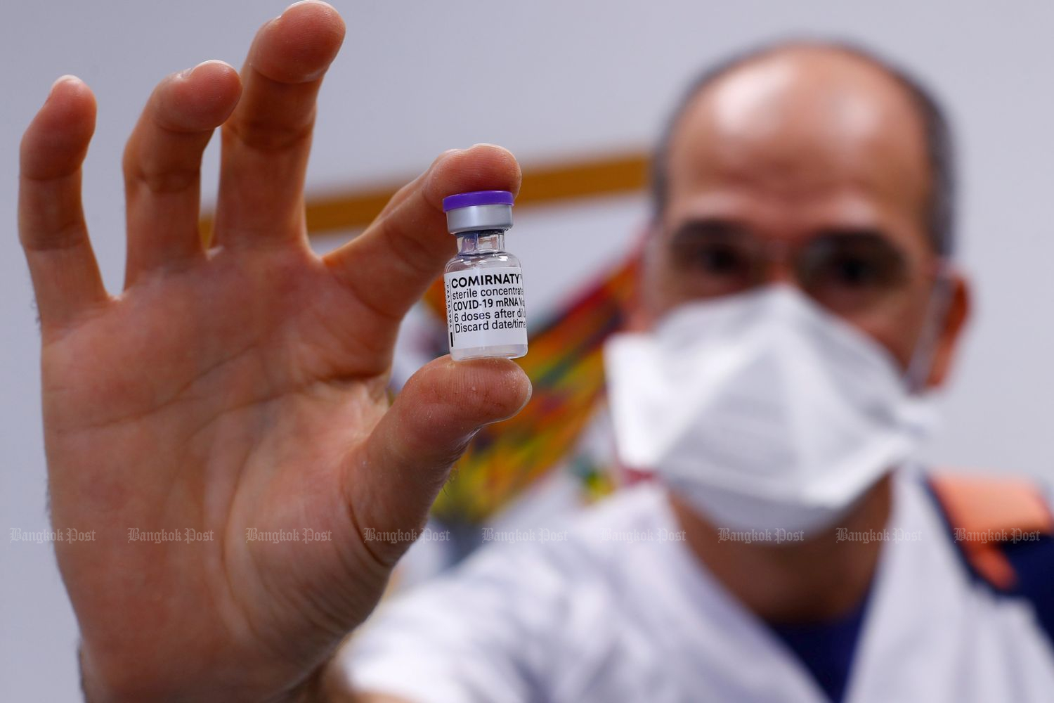 Nurse Guillermo Monzon holds a vial of Pfizer's Covid-19 vaccine in Telde on the island of Gran Canaria, Spain, on March 31. (Reuters photo)