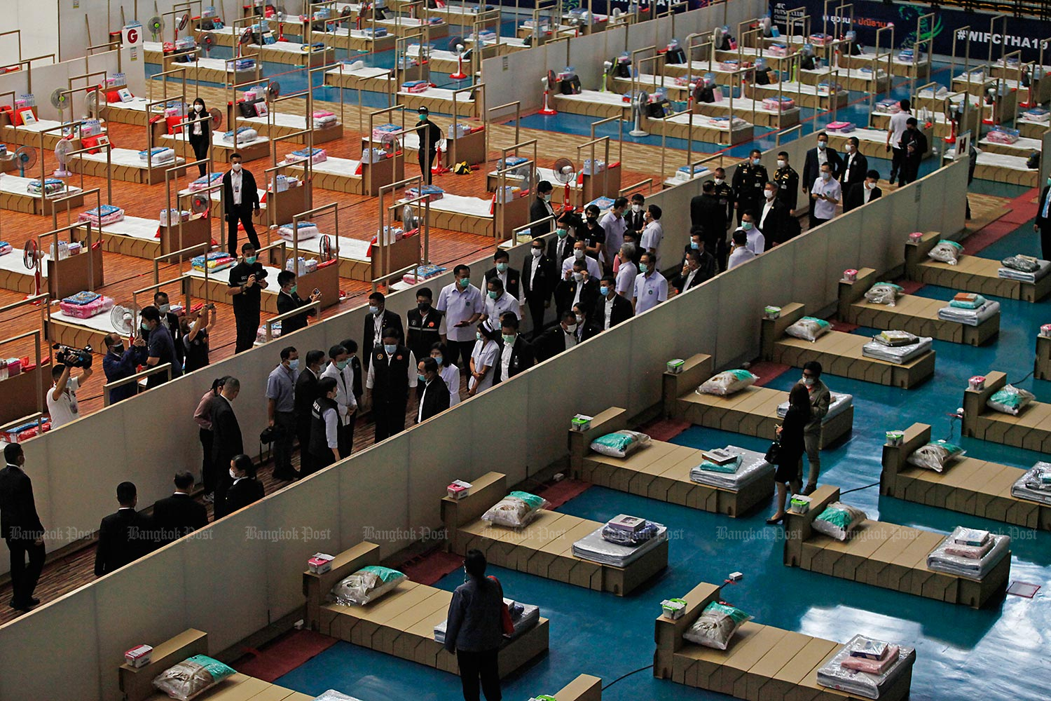Prime Minister Prayut Chan-o-cha leads an inspection of a field hospital at Erawan Hospital 2 in Bangkok's Nong Chok district on Wednesday. Many field hospitals are sprouting up across the city in the wake of a spike in Covid-19 infections. (Photo by Varuth Hirunyatheb) Prime Minister Prayut Chan-o-cha leads an inspection of a field hospital at Erawan Hospital 2 in Bangkok's Nong Chok district on Wednesday. Many field hospitals are sprouting up across the city in the wake of a spike in Covid-19 infections. (Photo by Varuth Hirunyatheb)