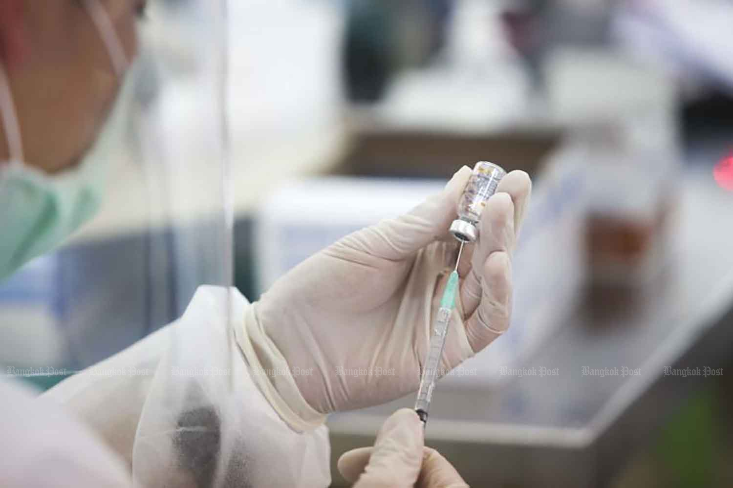 In this file photo, a healthcare worker prepares a syringe with a dose of Covid-19 vaccine as part of the government’s inoculation programme. 