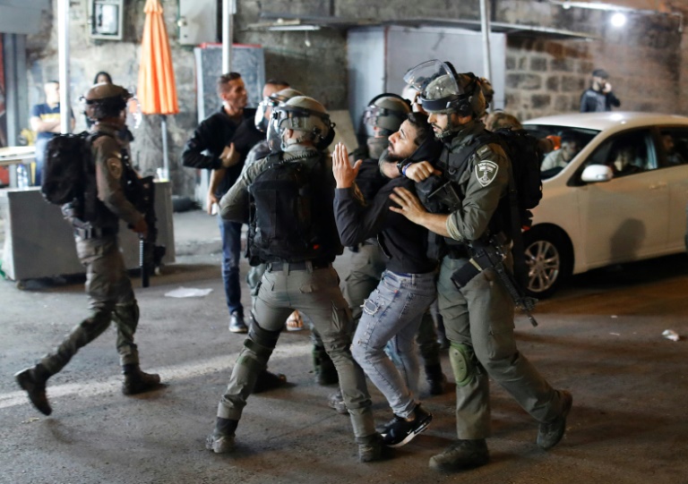 Israeli security forces detain a Palestinian protester outside the Damascus Gate in Jerusalem's Old City on April 23 Israeli security forces detain a Palestinian protester outside the Damascus Gate in Jerusalem's Old City on April 23