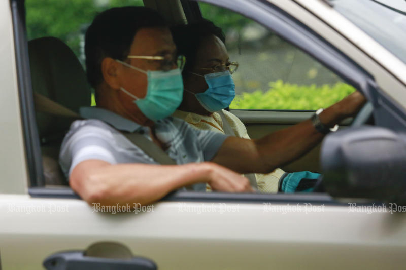 Face masks are required in vehicles with two or more people travelling on roads in Bangkok. (Photo: Arnun Chonmahatrakool)