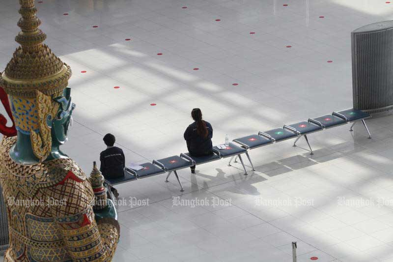 Officials sit at Suvarnabhumi airport. (Bangkok Post file photo)