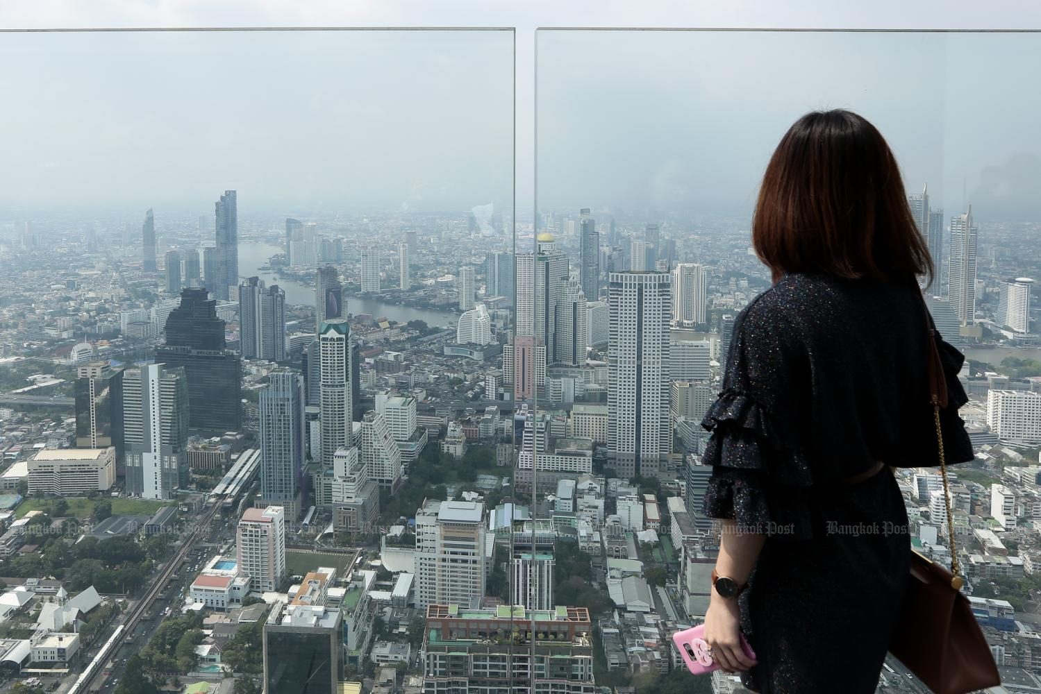 A view of high-rise buildings in Bangkok from Mahanakhon Skywalk, one of Thailand's tallest buildings. A website says Bangkok fits nomadic lifestyles. Photo by Patipat Janthong