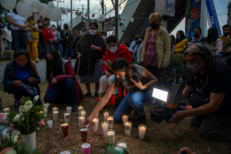 People light candles and place flowers at the site of a Mexico City metro rail accident that left 26 dead and sparked calls for justice People light candles and place flowers at the site of a Mexico City metro rail accident that left 26 dead and sparked calls for justice