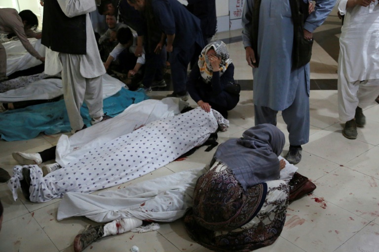 Family members and relatives mourn inside a hospital while sitting next to the bodies of victims who died in a blast outside a school in west Kabul Family members and relatives mourn inside a hospital while sitting next to the bodies of victims who died in a blast outside a school in west Kabul