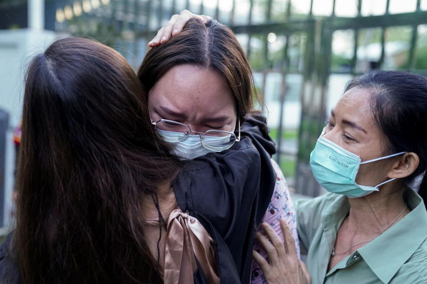 Protest leader Panusaya "Rung" Sithijirawattanakul (centre) reacts as she leaves prison after being granted bail, at the Central Women's Correctional Institute in Bangkok on May 6. She spent eight weeks in detention while awaiting trial on charges incuding lese majeste. (Photo: Reuters)