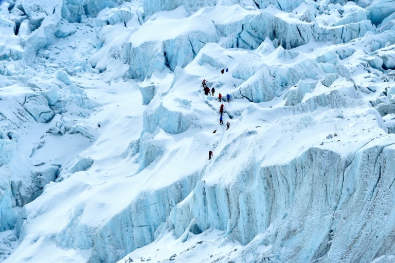 Mountaineers trek near the Mount Everest base camp. Mountaineers trek near the Mount Everest base camp.