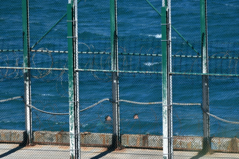 Some of the migrants swam into the Spanish enclave Some of the migrants swam into the Spanish enclave