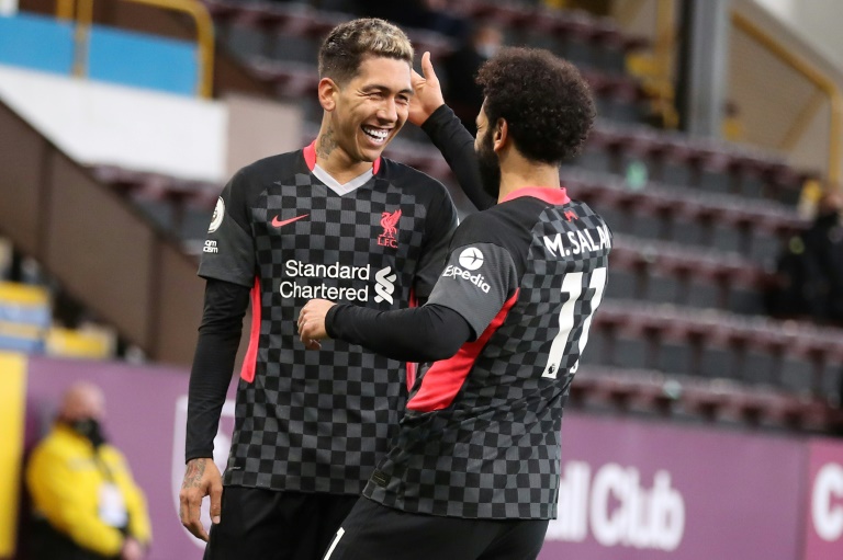 Liverpool's Roberto Firmino (left) celebrates scoring at Burnley Liverpool's Roberto Firmino (left) celebrates scoring at Burnley