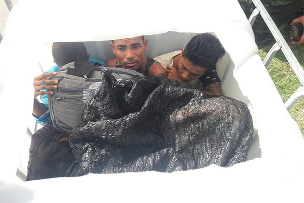 Illegal migrants caught hiding in plastic tank, barrels on truck