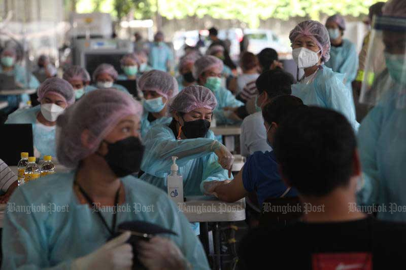 People receive vaccines at SCG in Bang Sue district, one of the vaccination centres in Bangkok. (Photo by Apichart Jinakul)