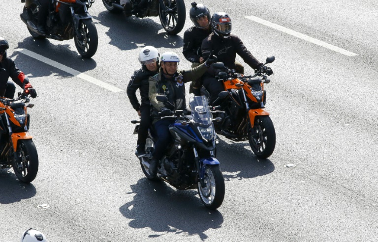 Brazil's Bolsonaro fined for maskless motorcyle rally