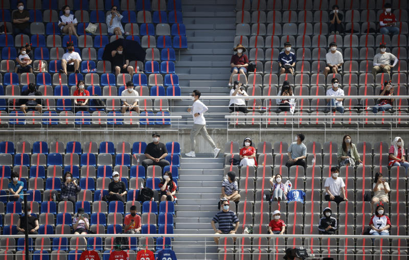 Fans are seen wearing protective face masks in the stands before the match between South Korea and Lebanon at Goyang Stadium, Goyang, South Korea, on Sunday. (Reuters photo) Fans are seen wearing protective face masks in the stands before the match between South Korea and Lebanon at Goyang Stadium, Goyang, South Korea, on Sunday. (Reuters photo)