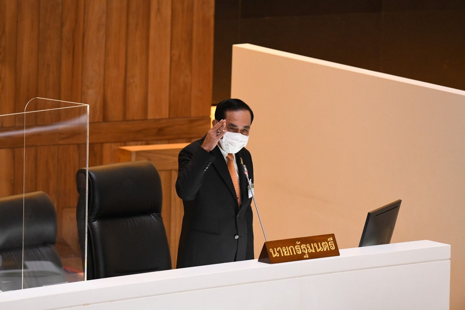 In this photo taken on June 9, Prime Minister Prayut Chan-o-cha gestures during a debate on the 500-billion-baht executive decree in the House of Representatives in Bangkok. (Thai parliament photo)