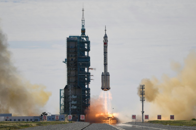 A Long March-2F carrier rocket, carrying the Shenzhou-12 spacecraft and a crew of three astronauts, lifts off from the Jiuquan Satellite Launch Centre in the Gobi desert, in northwest China. A Long March-2F carrier rocket, carrying the Shenzhou-12 spacecraft and a crew of three astronauts, lifts off from the Jiuquan Satellite Launch Centre in the Gobi desert, in northwest China.