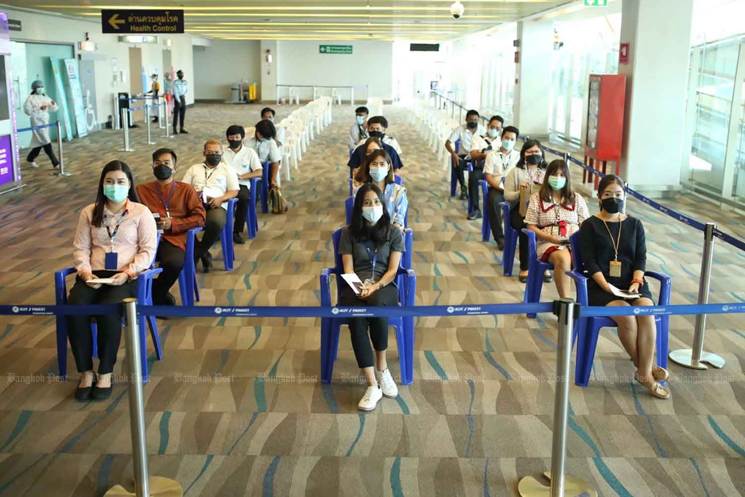 Officials conduct an exercise at Phuket airport on Thursday to prepare for the Phuket Sandbox project that was set to start on July 1. (Photo: Achadtaya Chuenniran)