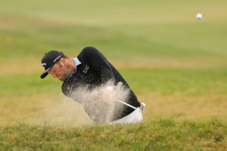 Spain's Jon Rahm blasts out of a bunker during Friday's second round of the US Open at Torrey Pines, where the world number three grinded out a one-under par 70.
