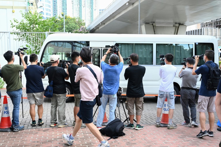 A van believed to be carrying the two executives arrives at court. A van believed to be carrying the two executives arrives at court.
