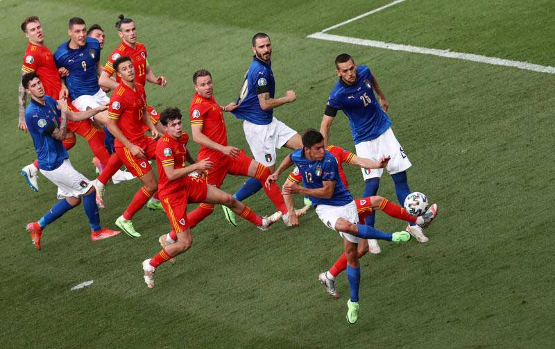 Italy's Matteo Pessina scores their first goal against Wales on Sunday. (Reuters photo) Italy's Matteo Pessina scores their first goal against Wales on Sunday. (Reuters photo)