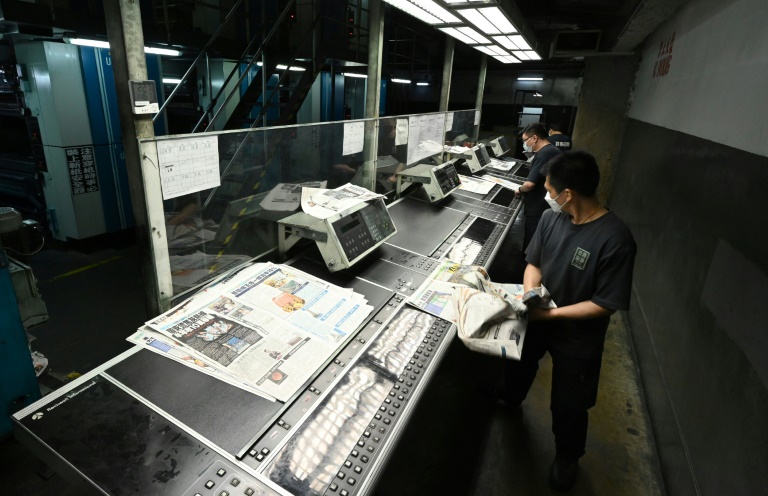 Staff work at the printing facility of Apple Daily in Hong Kong. Staff work at the printing facility of Apple Daily in Hong Kong.