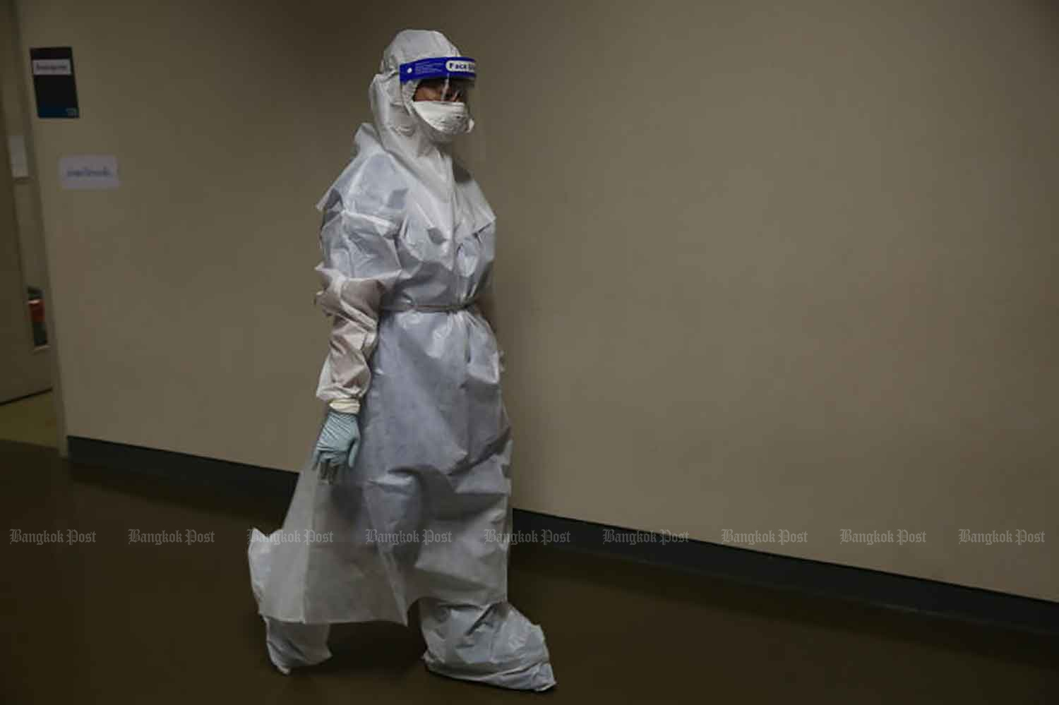 A medical worker is on duty at a field hospital set up for Covid-19 patients at the Bangkok Arena in Nong Chok district on June 16. (Photo: Varuth Hirunyatheb)