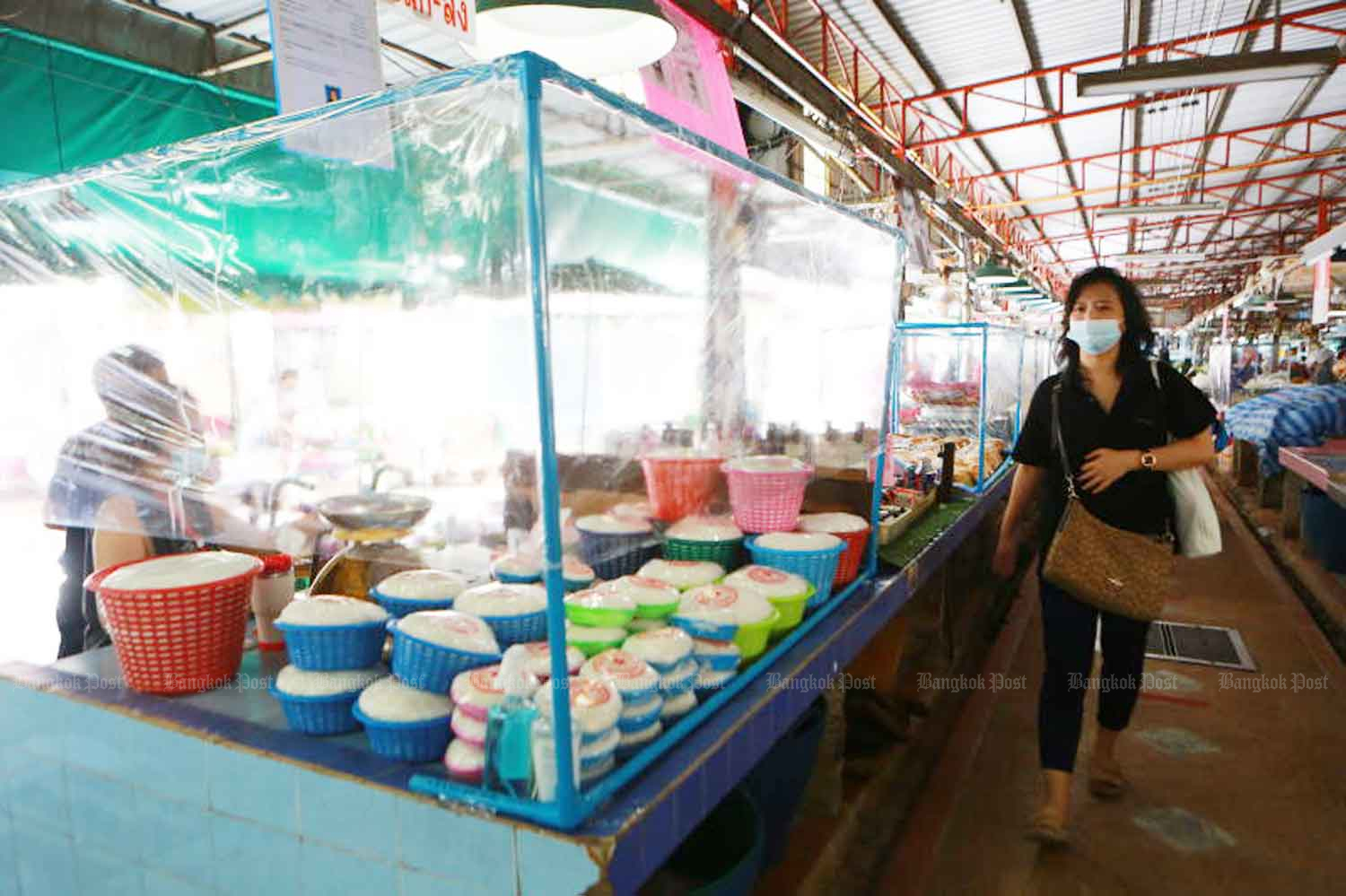 Customers return to Bang Kapi market in Bangkok as it reopens on Friday after being closed more than a month ago by an outbreak of Covid-19 disease. (Photo: Somchai Poomlard)