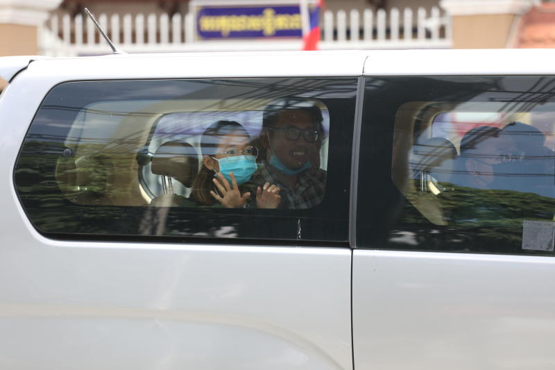 Detained members of the Mother Nature environmental group Sun Ratha and Yim Leanghy wave from a car after being charged with plotting and insulting the King, outside the court in Phnom Penh, Cambodia June 19, 2021. (Reuters photo) Detained members of the Mother Nature environmental group Sun Ratha and Yim Leanghy wave from a car after being charged with plotting and insulting the King, outside the court in Phnom Penh, Cambodia June 19, 2021. (Reuters photo)