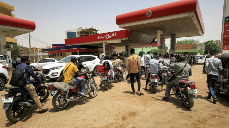 Motorcyclists queue-up for fuel at a petrol station in Sudan's capital Khartoum on June 10, 2021. Sudan has ended fuel subsidies as part of an IMF-backed reform programme, helping it secure a $2.5 billion loan from the financial institution. Motorcyclists queue-up for fuel at a petrol station in Sudan's capital Khartoum on June 10, 2021. Sudan has ended fuel subsidies as part of an IMF-backed reform programme, helping it secure a $2.5 billion loan from the financial institution.