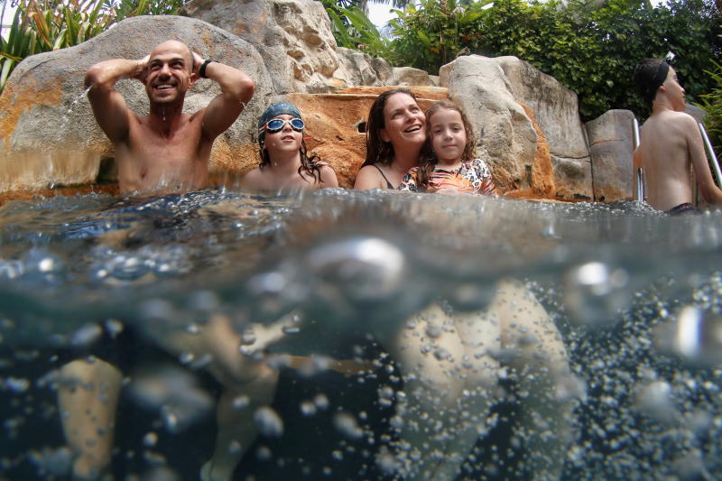 The Kalmar family, tourists from Israel, enjoy in a pool as Phuket reopens to overseas tourists, allowing foreigners fully vaccinated to visit the resort island without quarantine on Friday. (Reuters photo)