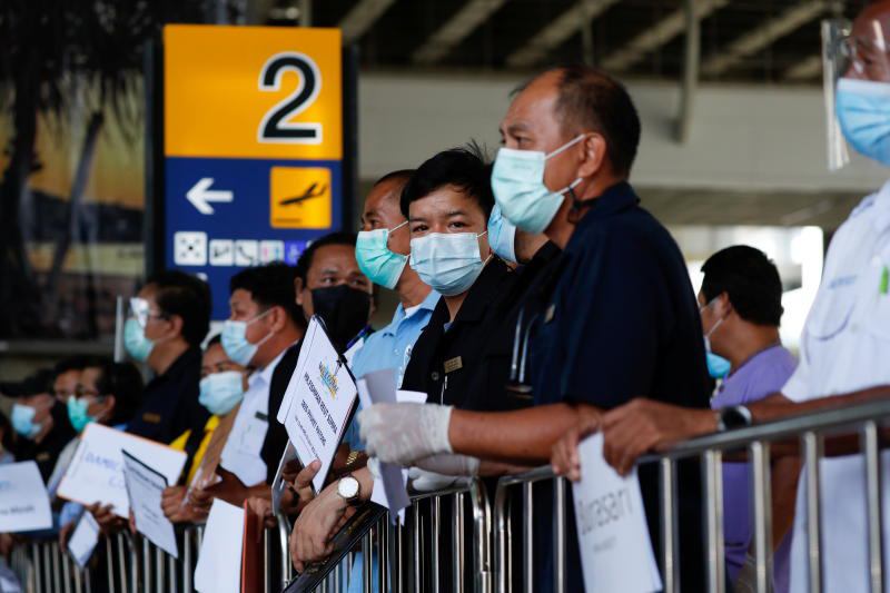 Hotel drivers wait for passengers at Phuket airport, as the province reopens to overseas tourists on July 1. (Photo: Reuters)