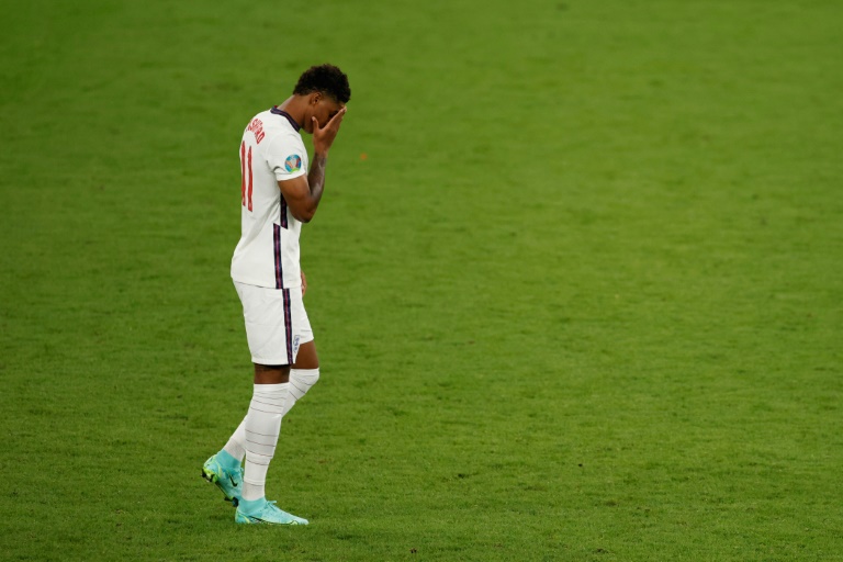 England's forward Marcus Rashford reacts after he fails to score in the penalty shootout during the Euro 2020 final football match between Italy and England at the Wembley Stadium in London on Sunday. England's forward Marcus Rashford reacts after he fails to score in the penalty shootout during the Euro 2020 final football match between Italy and England at the Wembley Stadium in London on Sunday.