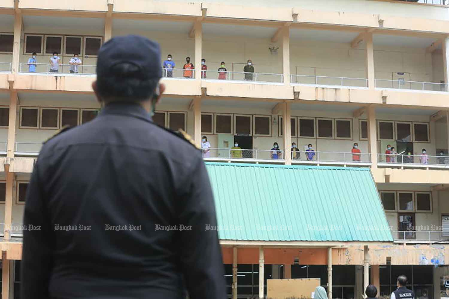 A city inspector surveys the Chao Phraya Commercial Technological College in Bangkok's Ratchathewi district on Tuesday. The college has been turned into a community isolation centre for Covid-19 patients. (Photo: Pornprom Satrabhaya)