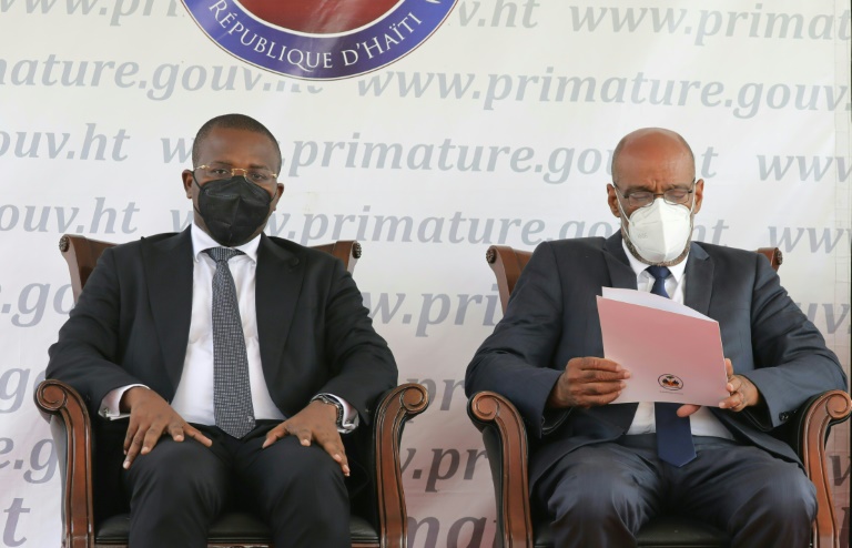 Rivals for power -- Haiti's former interim leader Claude Joseph (L) and new Prime Minister Ariel Henry in Haiti's capital Port-au-Prince as Henry and his new government are sworn in.