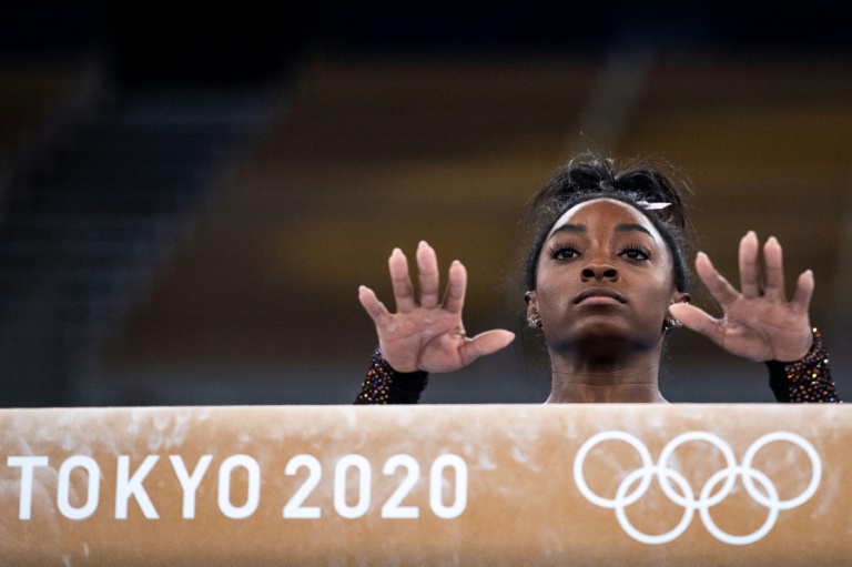 Biles launches history bid as surfing, skateboarding make Olympic bow