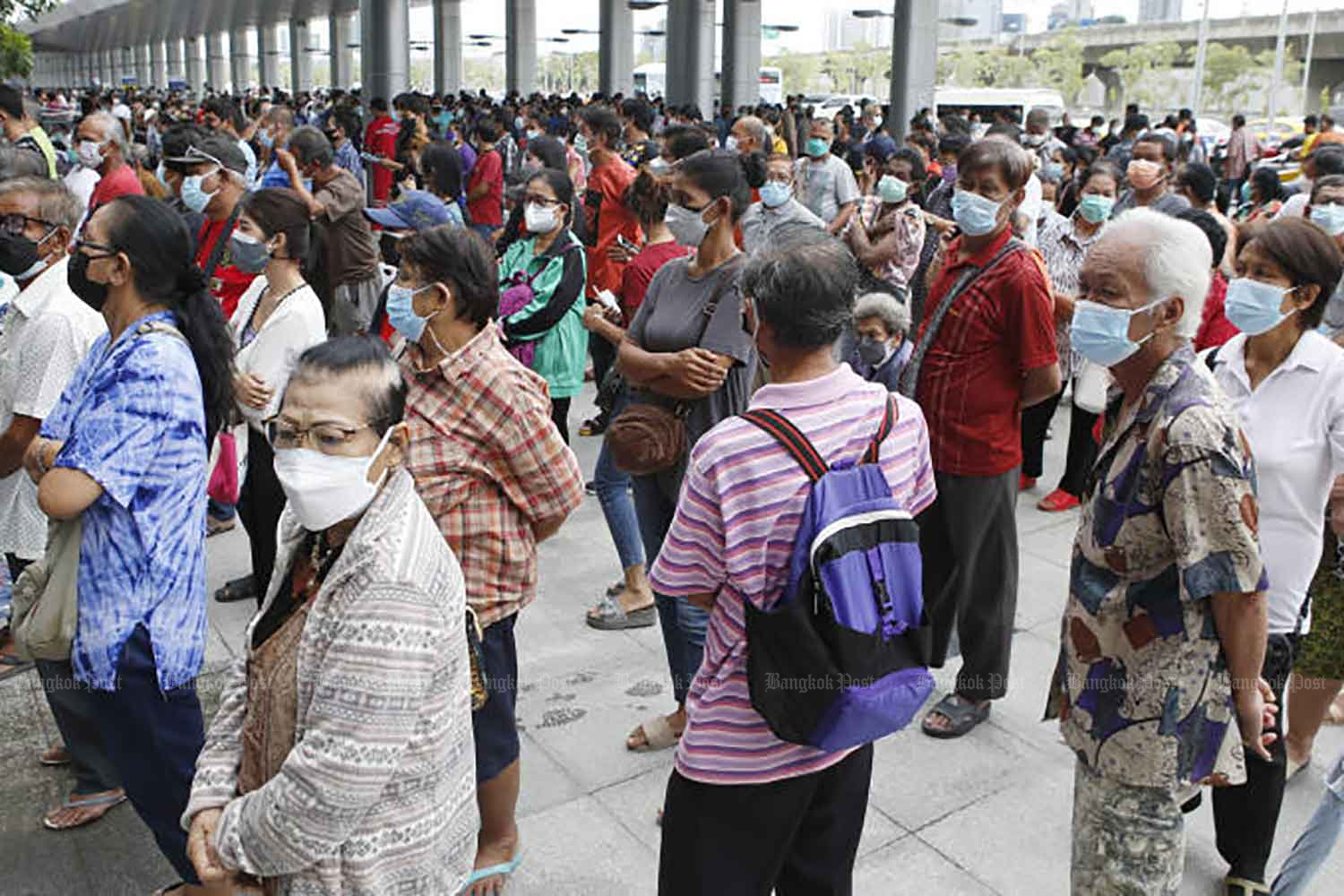 Large crowds wait for Covid-19 vaccinations at the Bang Sue Grand Station in Bangkok on Sunday. (Photo: Apichit Jinakul)