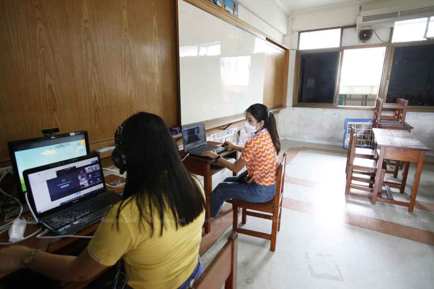 Teachers conduct online classes from a school in Samut Prakan province last month. (Photo: Wichan Charoenkiatpakul)