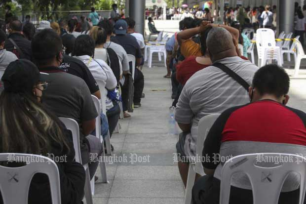 Queues remain long Tuesday at Bang Sue Grand Station, where Covid-19 jabs are being administered. (Photo: Pattarapong Chatpattarasill)