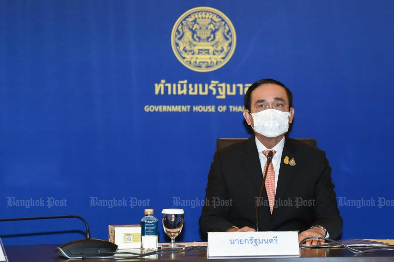 Gen Prayut Chan-o-cha holds a video conference on the Covid-19 crisis at Government House with top business leaders on July 21, 2021. The prime minister reportedly said he hoped the situation would improve in the next four to six weeks. (Government House photo)