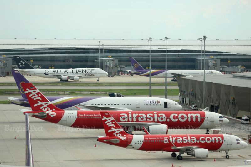 Thai AirAsia jets are seen at Don Mueang airport. (Bangkok Post file photo)