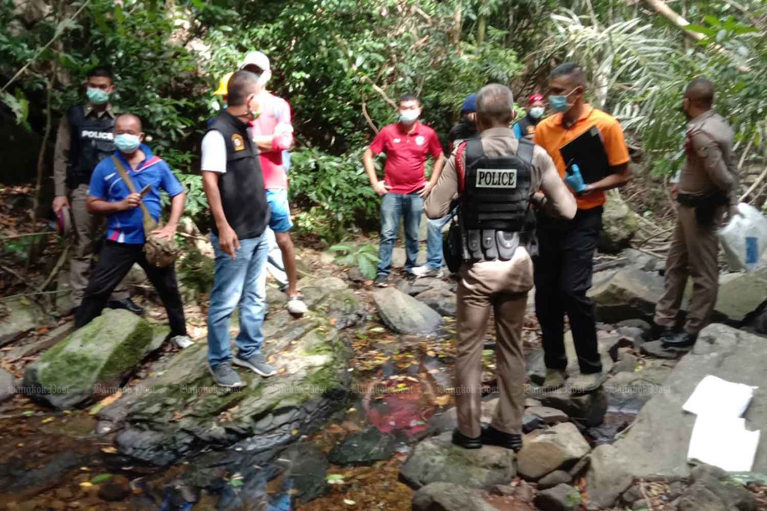 Police gather evidence at the crime scene on the Ao Yon waterfall in Muang district of Phuket on Thursday afternoon. (Photo: Achadthaya Chuenniran)