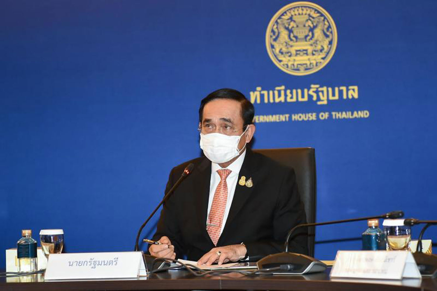 Prime Minister Prayut Chan-o-cha chairs a meeting with representatives of the Thai Chamber of Commerce and company executives tackle the Covid-19 pandemic at Government House on July 21 via video conference. (Government House photo)